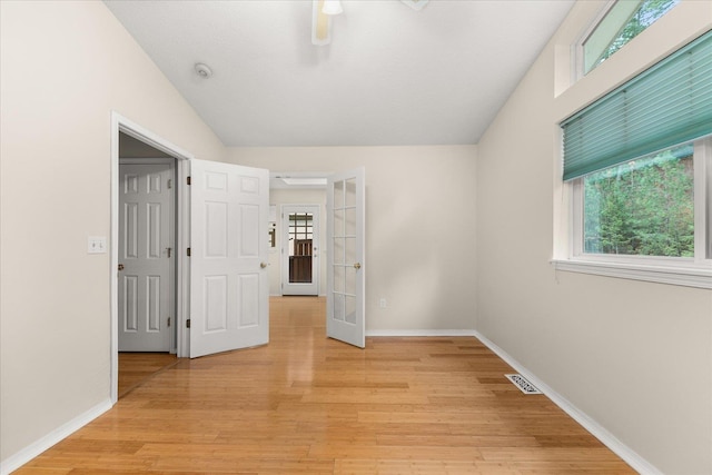 4815 S Kip Ln, Spokane, WA 99224 - unfurnished bedroom featuring french doors, light wood-type flooring, baseboards, and ceiling fan