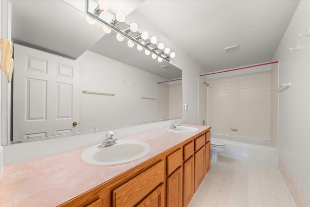 full bathroom with vanity, toilet, and tiled shower / bath combo