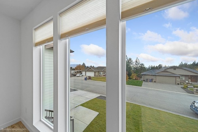 doorway to outside featuring carpet