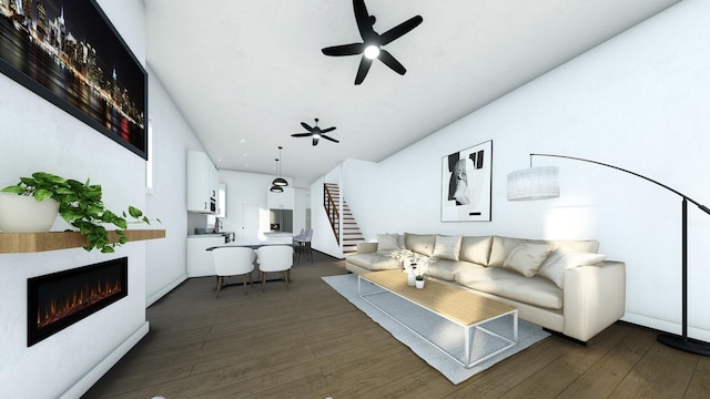 living room with ceiling fan and dark hardwood / wood-style flooring