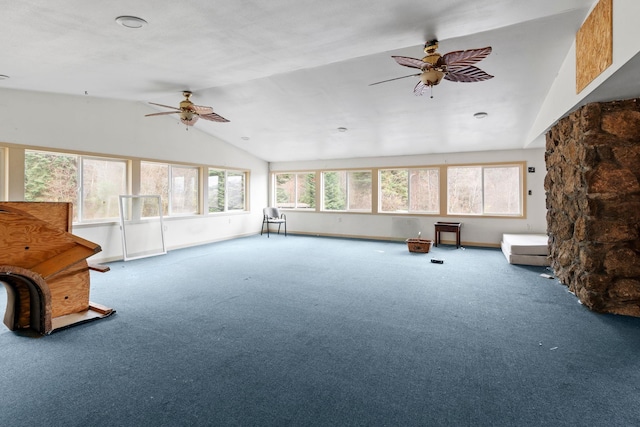 unfurnished sunroom with ceiling fan and vaulted ceiling