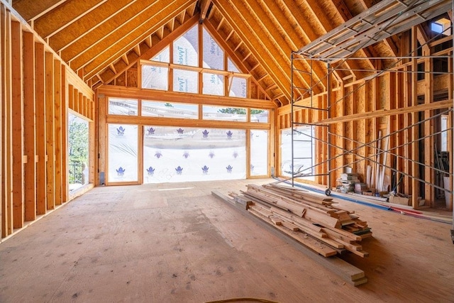 miscellaneous room with high vaulted ceiling