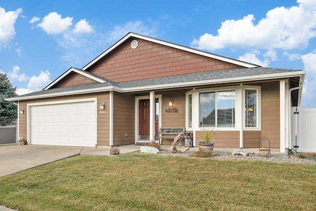 view of front of home featuring a garage and a front lawn