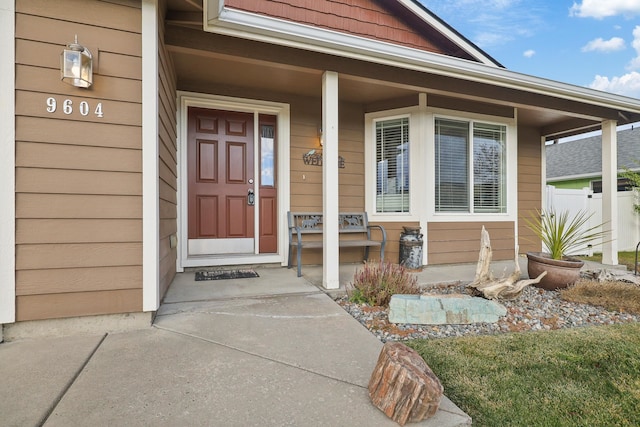 doorway to property featuring covered porch