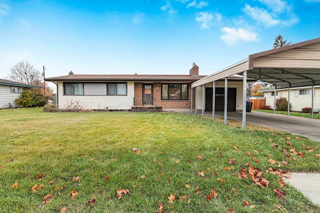 ranch-style home featuring a carport and a front lawn