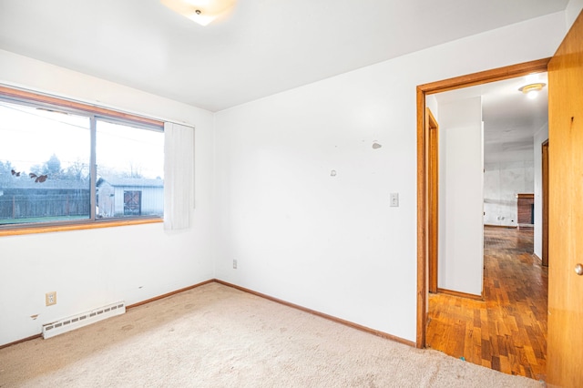 spare room featuring wood-type flooring