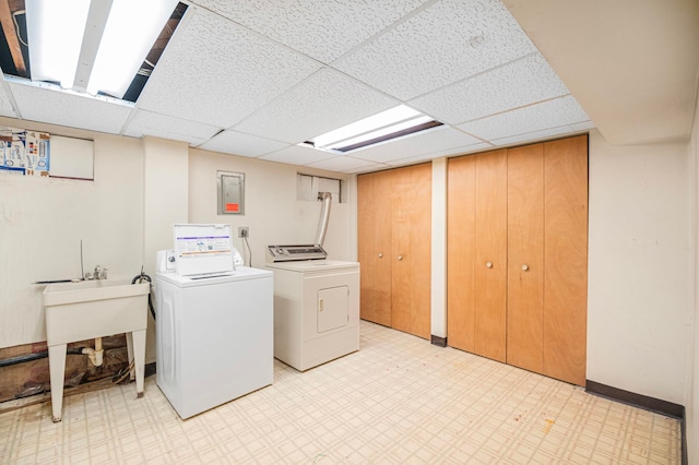 laundry area featuring washer and clothes dryer and sink