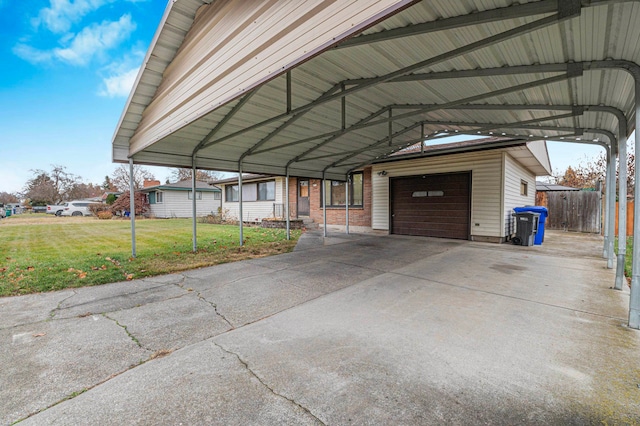 view of parking / parking lot featuring a carport, a garage, and a yard