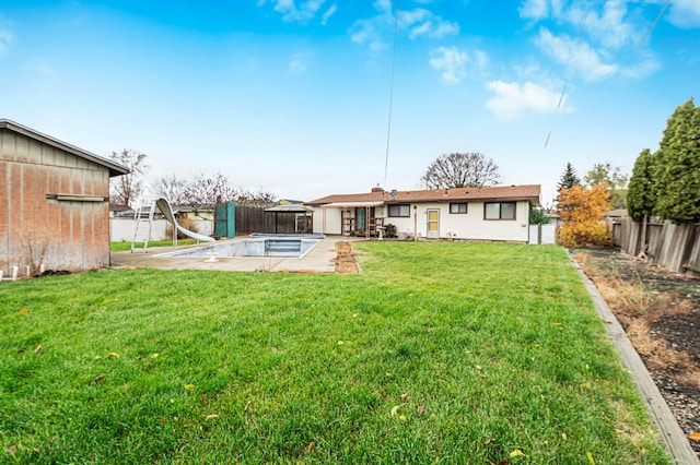 view of yard with a patio area and a fenced in pool