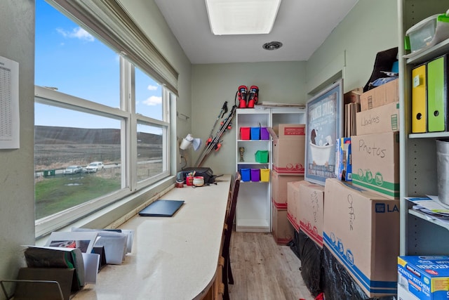 office area with light hardwood / wood-style floors