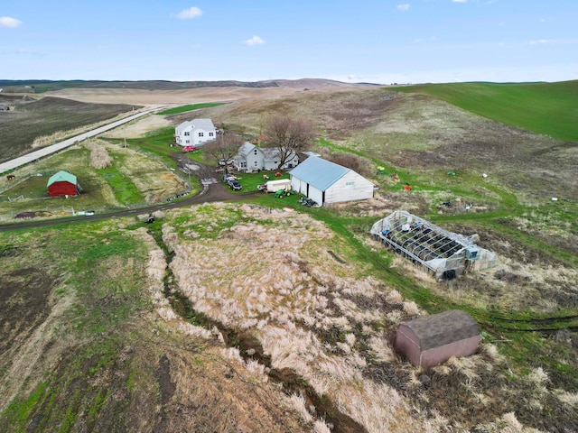 birds eye view of property with a rural view