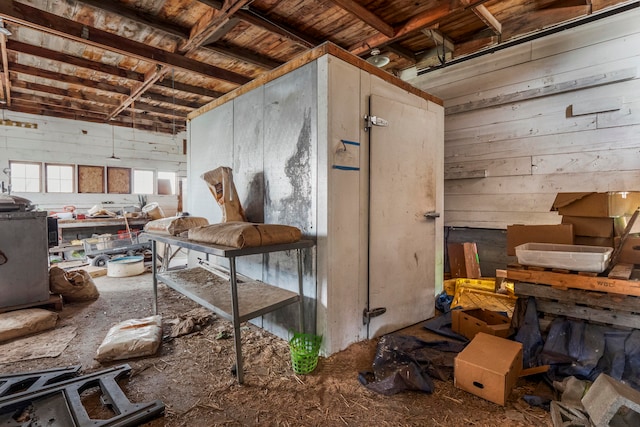 miscellaneous room featuring wooden walls