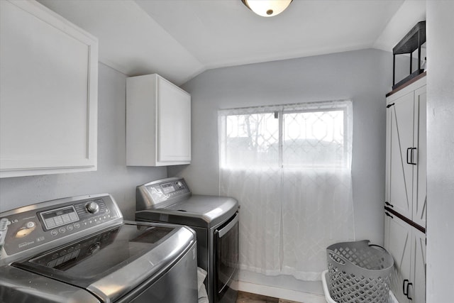 laundry area with cabinets and separate washer and dryer