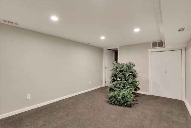 interior space featuring dark carpet