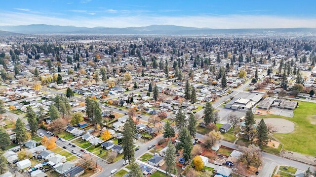 birds eye view of property with a mountain view