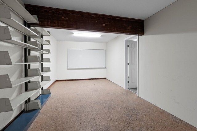 walk in closet with carpet floors and vaulted ceiling