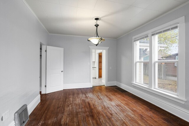 interior space with dark hardwood / wood-style flooring, ceiling fan, and ornamental molding