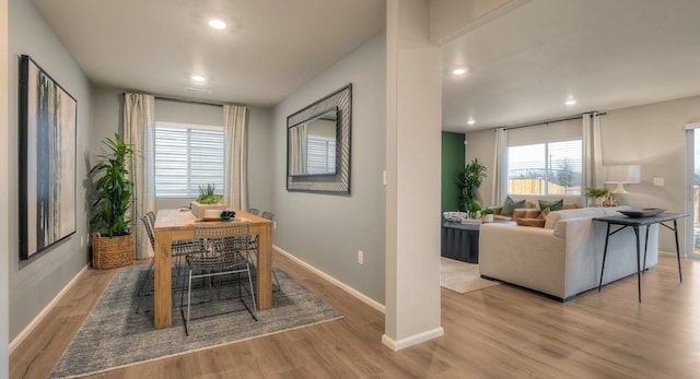 dining area featuring light wood-type flooring