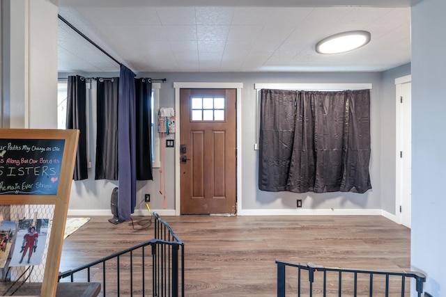 entrance foyer featuring hardwood / wood-style flooring