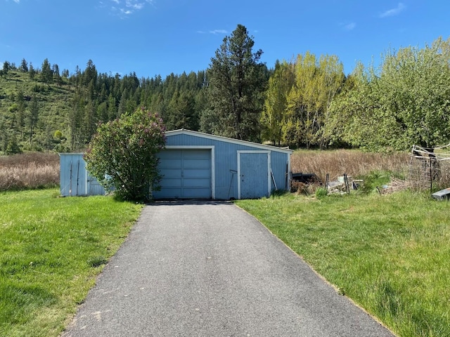 garage with a lawn