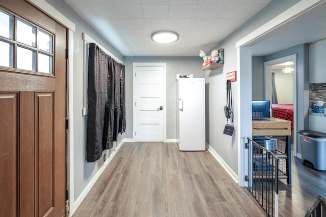 hallway featuring light wood-type flooring