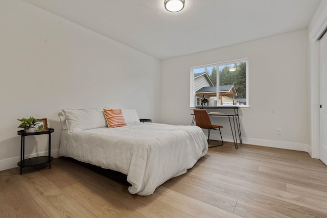 bedroom with light hardwood / wood-style flooring