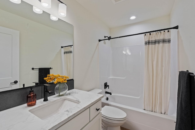 full bathroom with vanity, toilet, and shower / tub combo