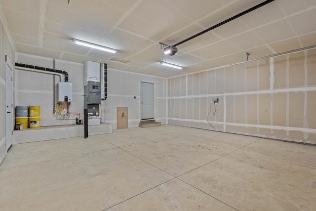 garage featuring a garage door opener and water heater