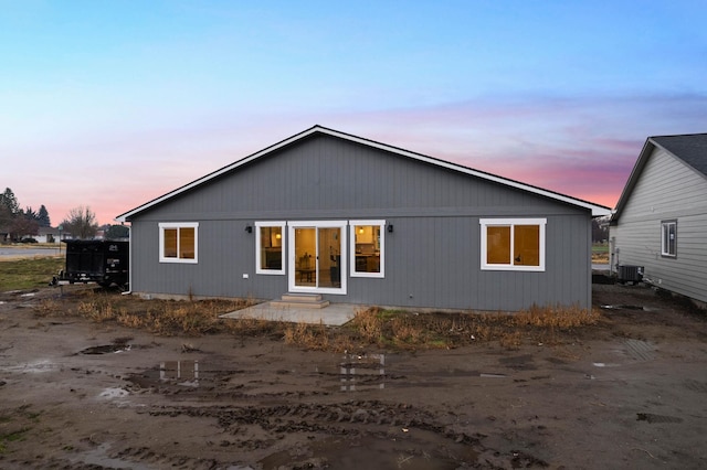 back house at dusk with cooling unit