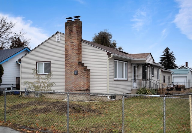 view of property exterior featuring a lawn