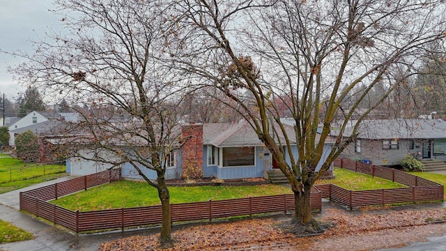 view of front facade featuring a front yard and a garage