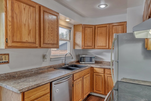 kitchen with light hardwood / wood-style floors, sink, stainless steel appliances, and range hood