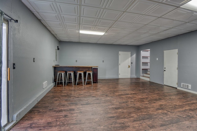 empty room featuring dark wood-type flooring