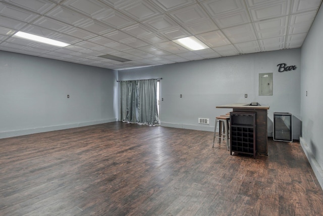 interior space with dark hardwood / wood-style flooring and electric panel