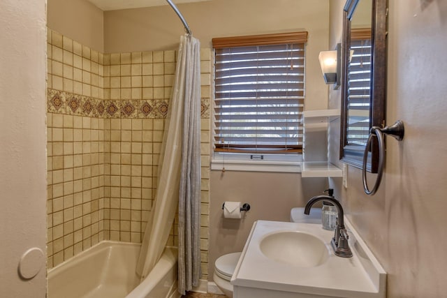 full bathroom with shower / bath combo, vanity, and toilet