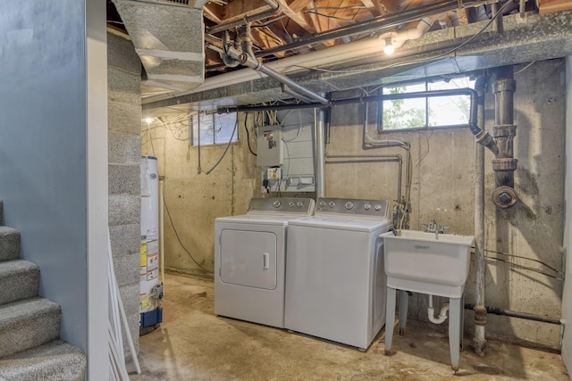 washroom with washer and dryer and sink