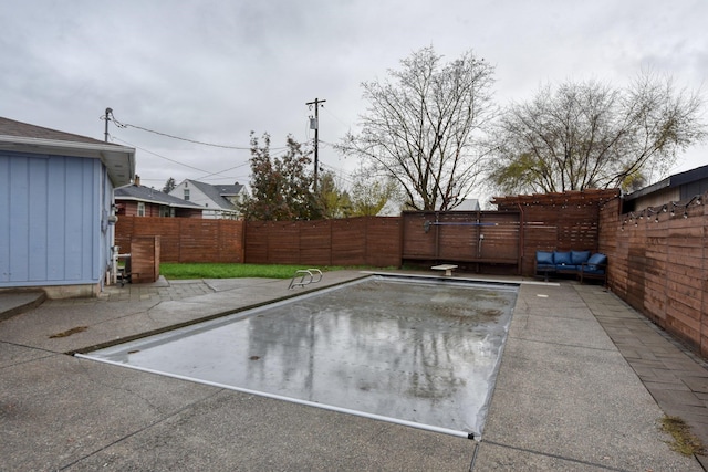 view of pool featuring a patio