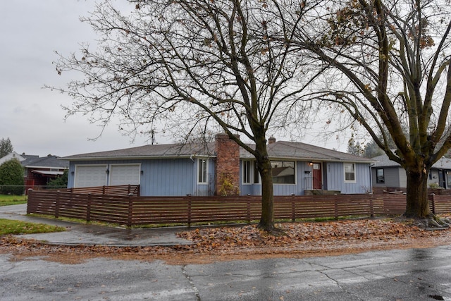 view of front of property with a garage