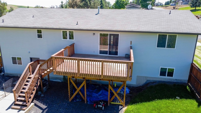 back of house with a wooden deck