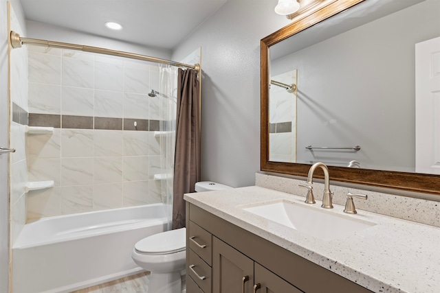 full bathroom featuring vanity, shower / tub combo, and toilet