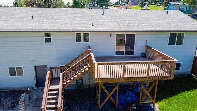 rear view of property with a wooden deck