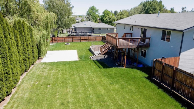 view of yard featuring a patio area and a deck