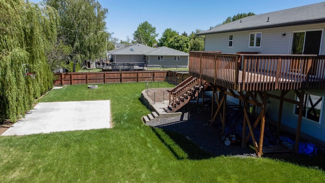 view of yard featuring a fire pit and a wooden deck