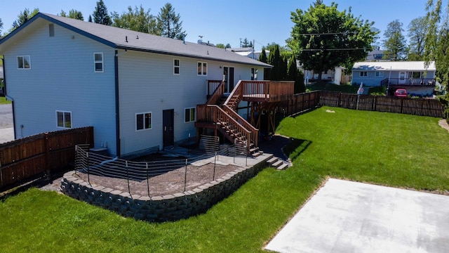 back of property featuring a patio area, a deck, a yard, and central AC