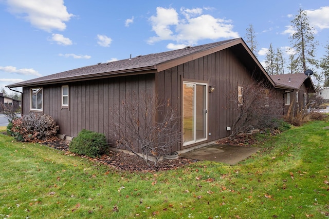 view of property exterior featuring a lawn