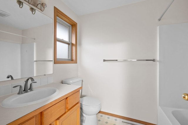 full bathroom featuring vanity, toilet, and washtub / shower combination