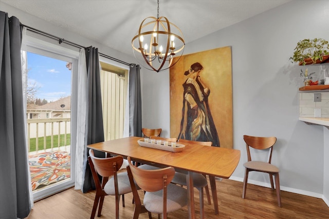 living room featuring light hardwood / wood-style floors and a notable chandelier