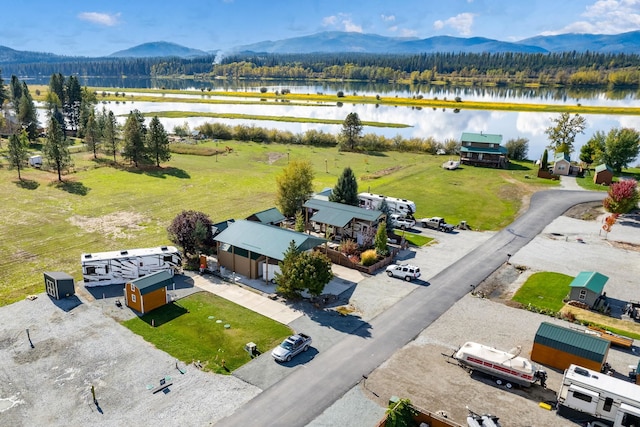 birds eye view of property featuring a water and mountain view