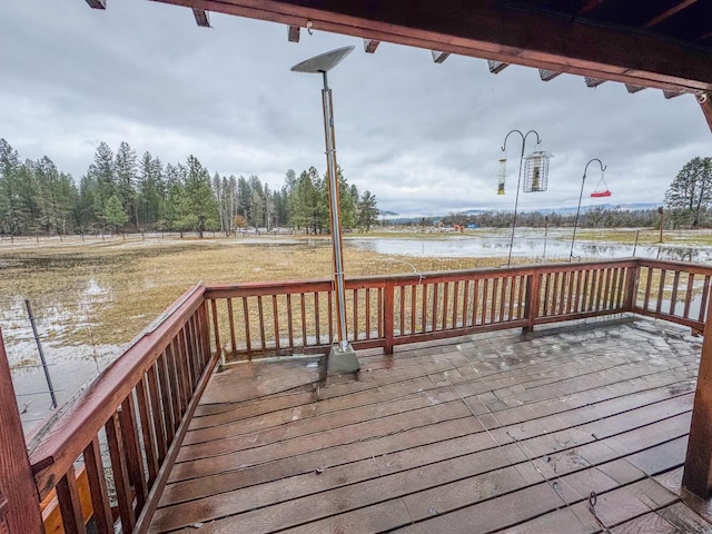 wooden terrace with a water view