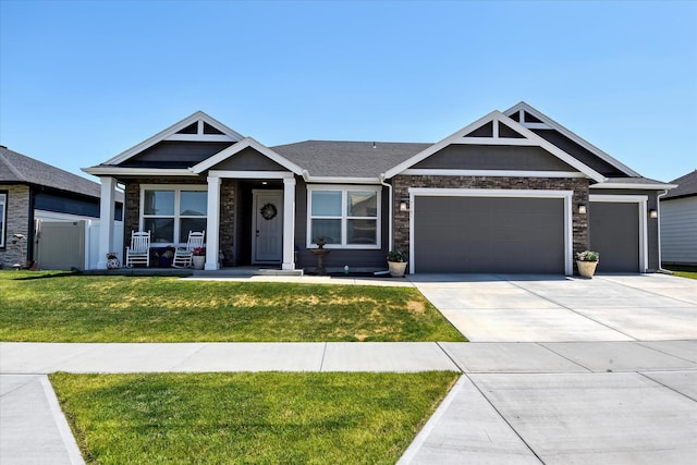 craftsman-style home with a front yard and a garage